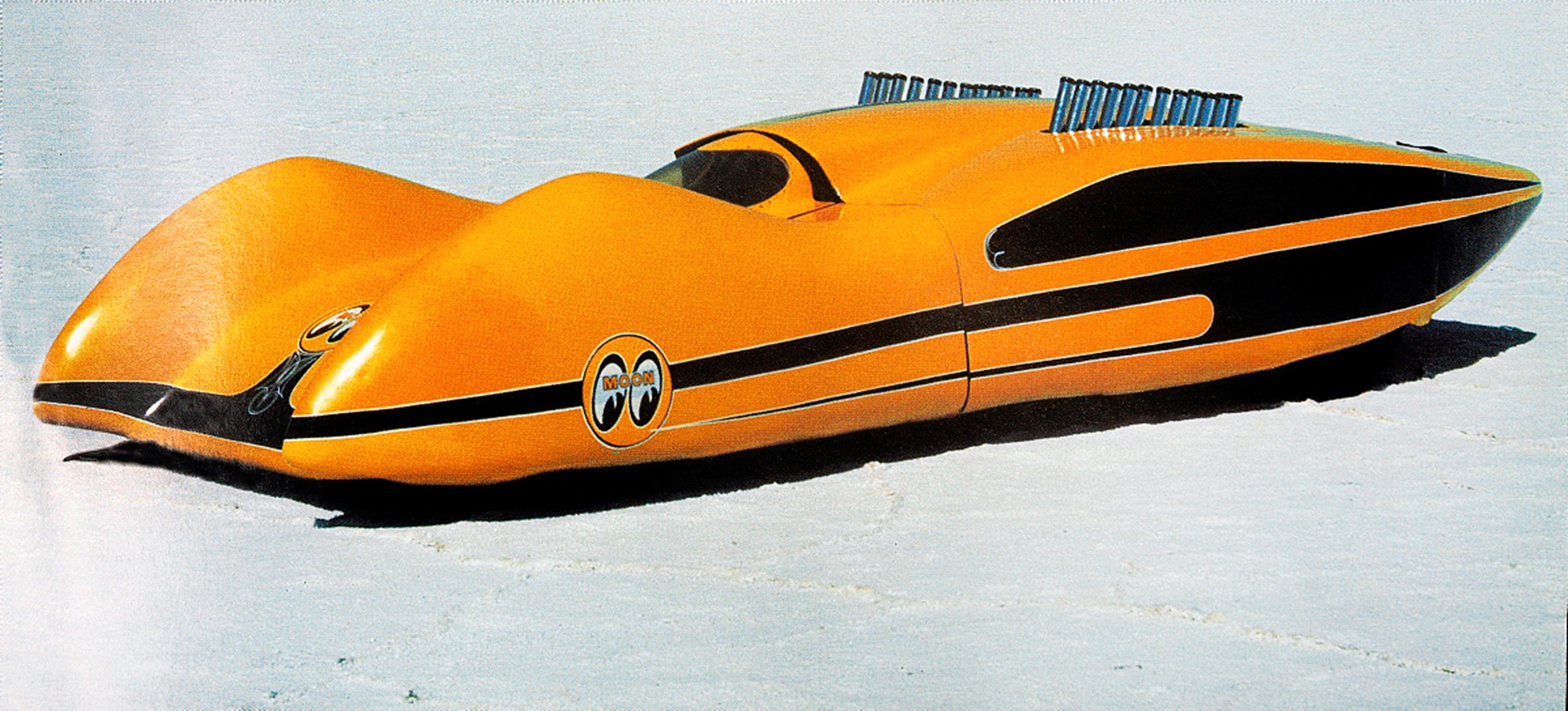 Ursprungligen byggds ”Moonliner” 1959 av skulptören Jocko Johnson och hade då en 3000 hk Allison V12-motor från ett flygplan. Efter att streamlinern satt ett hastighetsrekord på Bonneville med en sluthastighet på 285 mph - sålde Jocko bilen 1964 till Dean Moon. Han ersatte V12:an med en Chevy big block V8 och använde den mest till uppvisningskörningar, utställningar och reklam för sitt företag.